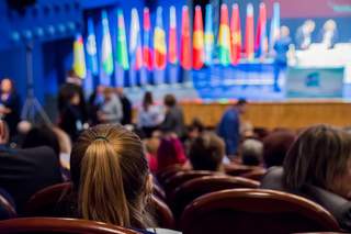 Woman looks at the podium
